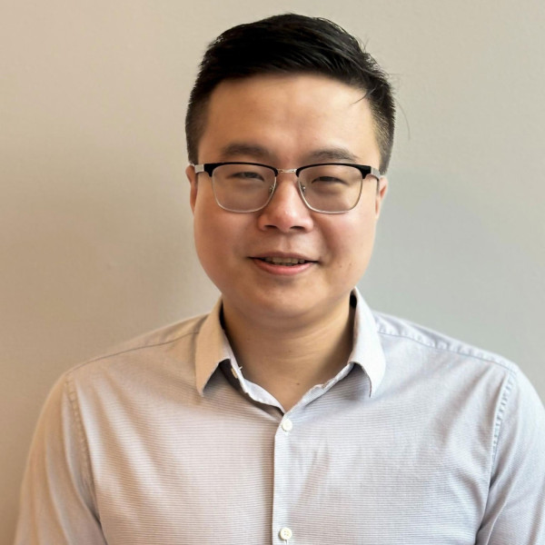Professional headshot of Qi Tang