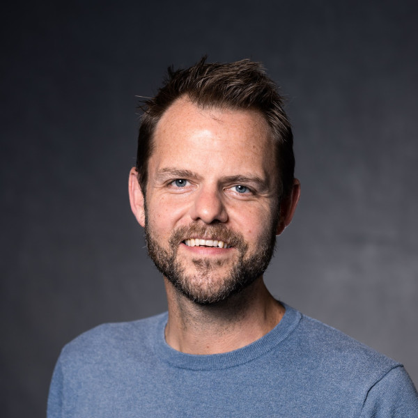 Professional headshot of Justin Burton